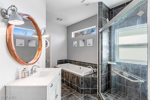 bathroom featuring a garden tub, vanity, visible vents, and a shower stall