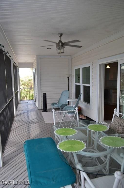 exterior space featuring covered porch and a ceiling fan