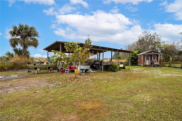 2915 Ortona Locks Rd, Moore Haven, FL 33471 - view of yard featuring an outdoor structure and a carport