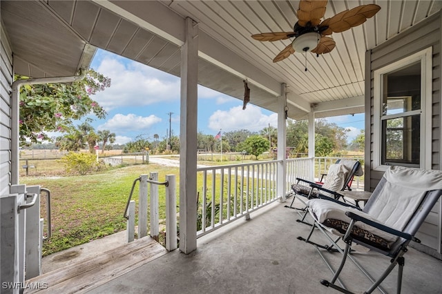 2915 Ortona Locks Rd, Moore Haven, FL 33471 - porch with a ceiling fan and a lawn