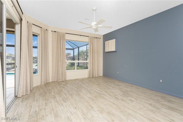 empty room featuring ceiling fan and light wood-type flooring