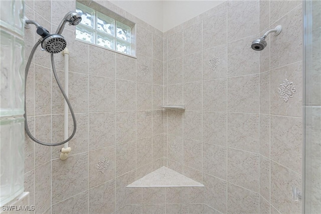 bathroom with tiled shower