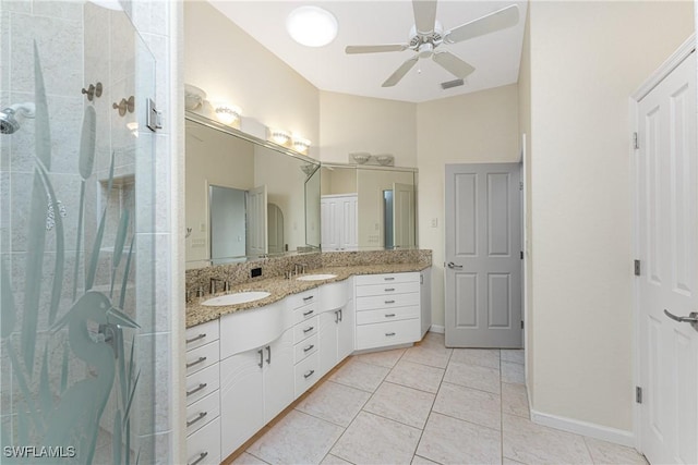 bathroom with an enclosed shower, vanity, tile patterned floors, and ceiling fan