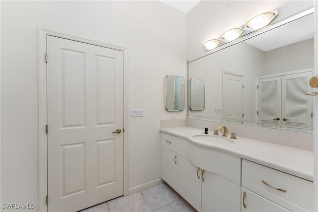 bathroom featuring tile patterned flooring and vanity