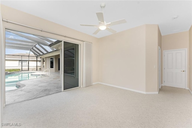 unfurnished room featuring ceiling fan and light colored carpet