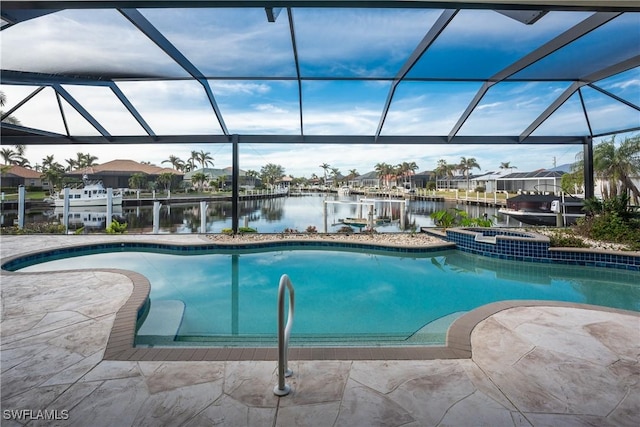 view of swimming pool featuring a patio, glass enclosure, an in ground hot tub, and a water view