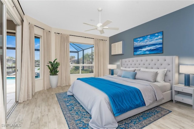 bedroom with access to outside, ceiling fan, and light hardwood / wood-style floors