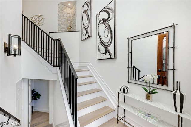 stairway featuring hardwood / wood-style floors