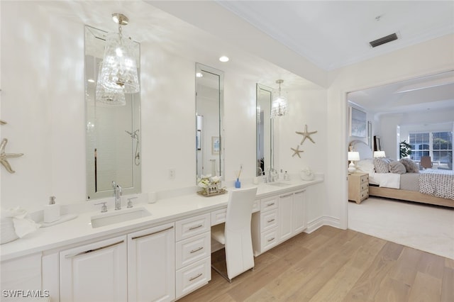 bathroom featuring hardwood / wood-style floors and vanity