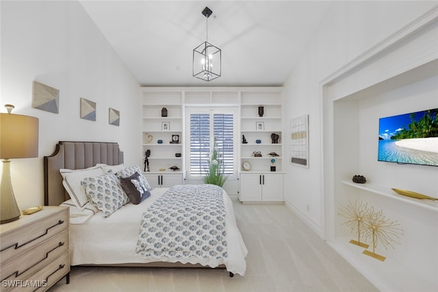 bedroom with light carpet and a notable chandelier