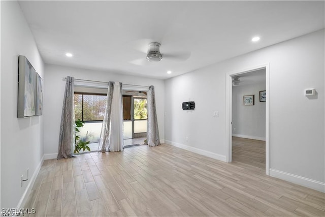 unfurnished room featuring ceiling fan and light hardwood / wood-style flooring