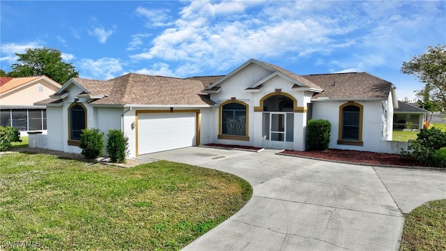 ranch-style home with a front yard and a garage