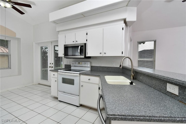 kitchen featuring white range with electric stovetop, ceiling fan, sink, light tile patterned floors, and white cabinetry