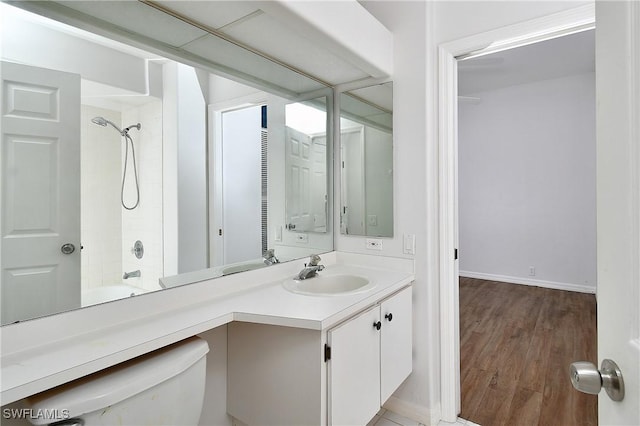 full bathroom with vanity, toilet, wood-type flooring, and tub / shower combination