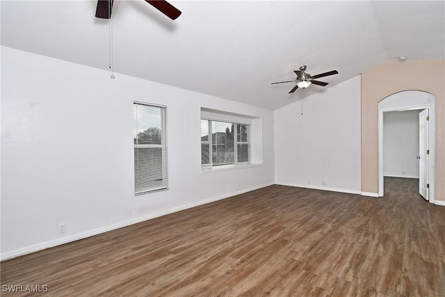 unfurnished living room with ceiling fan, dark hardwood / wood-style floors, and lofted ceiling