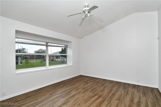 empty room featuring dark wood-type flooring, ceiling fan, and lofted ceiling