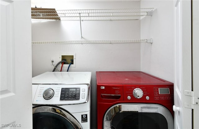 clothes washing area featuring separate washer and dryer