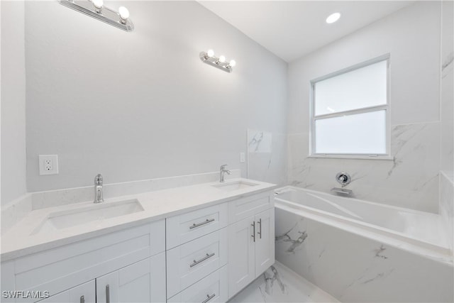 bathroom with a bathing tub and vanity