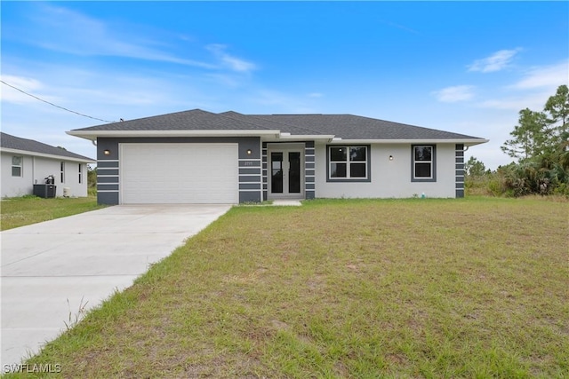 ranch-style home with a front lawn and a garage