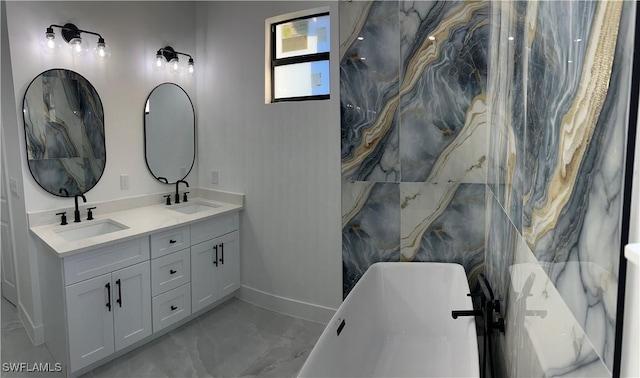 bathroom featuring a washtub and vanity