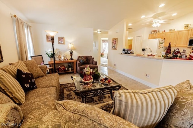 tiled living room featuring ceiling fan