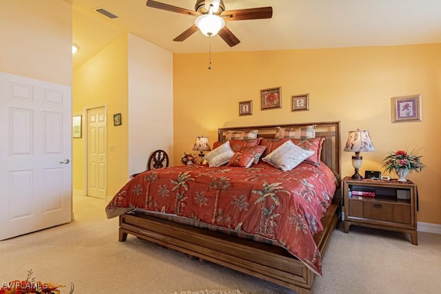 carpeted bedroom featuring ceiling fan and lofted ceiling