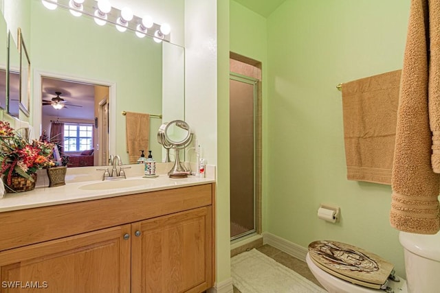 bathroom with ceiling fan, toilet, walk in shower, and vanity