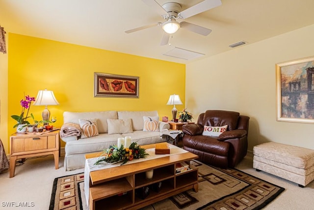 carpeted living room featuring ceiling fan