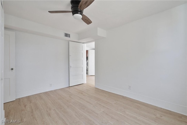 empty room with light wood-type flooring and ceiling fan