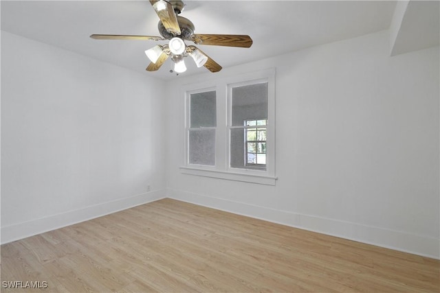 spare room featuring light hardwood / wood-style floors and ceiling fan