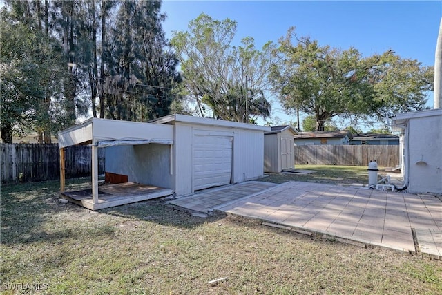 view of outbuilding featuring a lawn