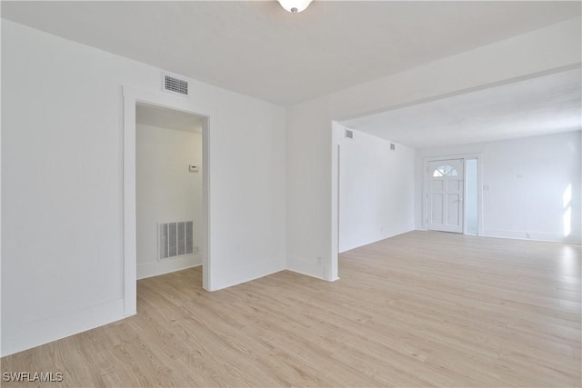 spare room featuring light hardwood / wood-style flooring