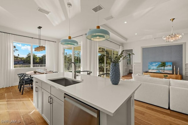 4584 W Alhambra Cir, Naples, FL 34103 - kitchen featuring sink, pendant lighting, a center island with sink, light hardwood / wood-style flooring, and dishwasher