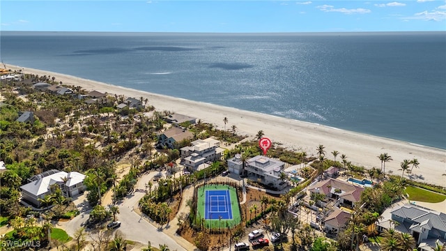 bird's eye view with a view of the beach and a water view