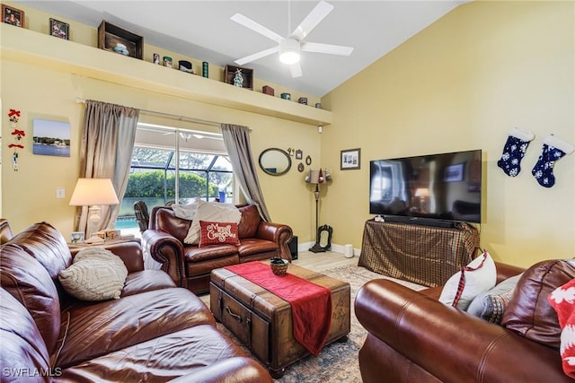 living room with ceiling fan and lofted ceiling