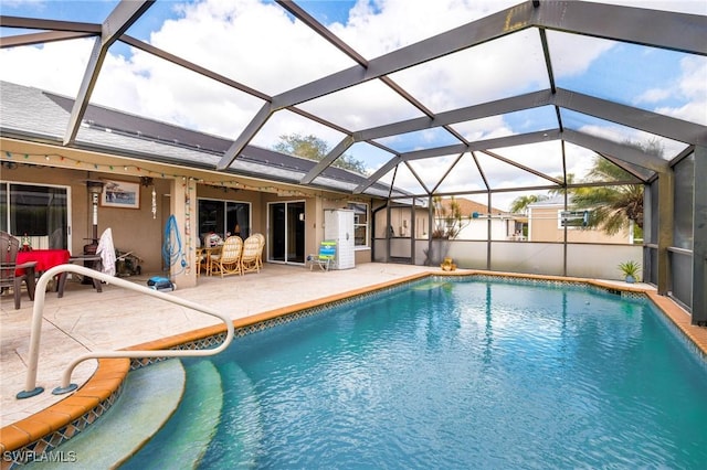 view of swimming pool with a patio, ceiling fan, and a lanai