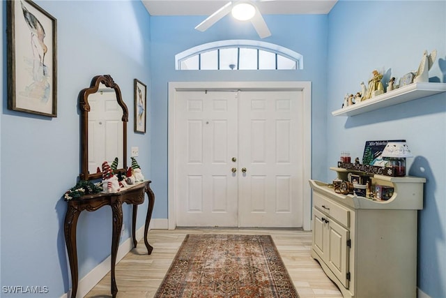 entryway featuring light hardwood / wood-style flooring and ceiling fan