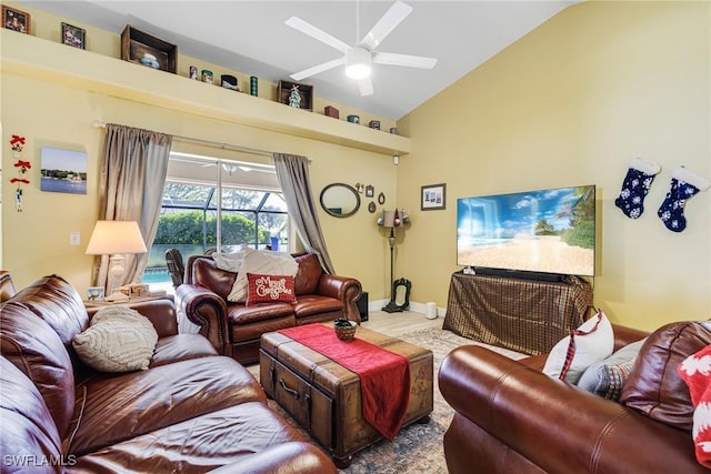 living room with high vaulted ceiling and ceiling fan