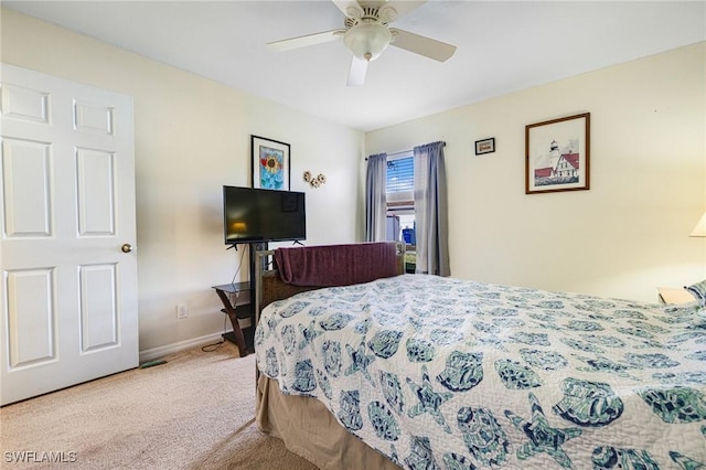 bedroom featuring light colored carpet and ceiling fan