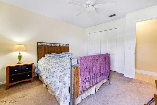 bedroom featuring ceiling fan, carpet floors, and a closet