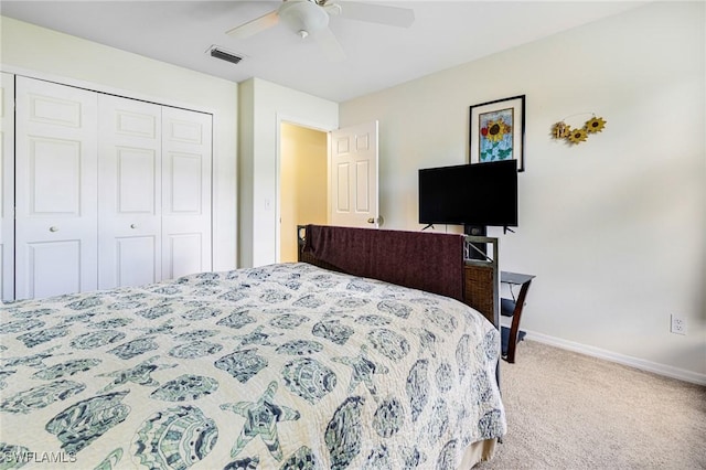 carpeted bedroom with a closet and ceiling fan