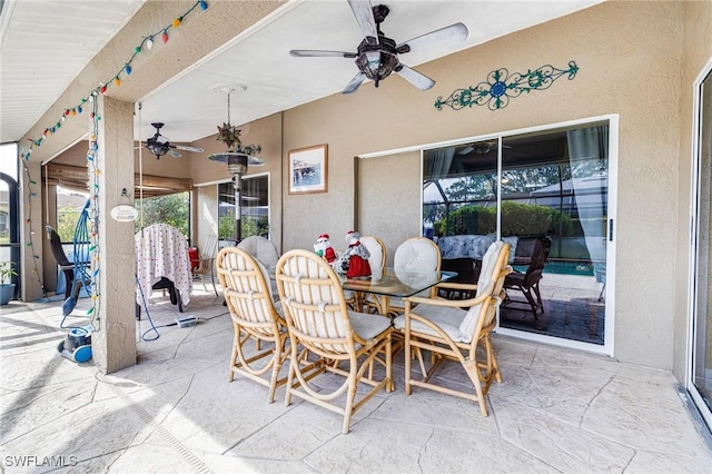 view of patio featuring ceiling fan