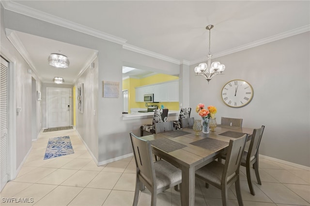 tiled dining room featuring an inviting chandelier and ornamental molding