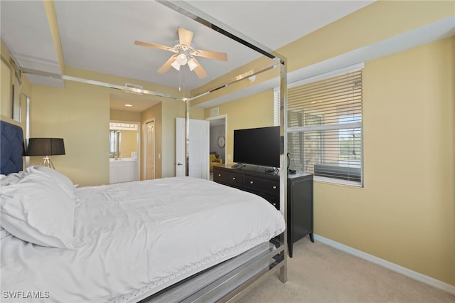 carpeted bedroom featuring connected bathroom and ceiling fan