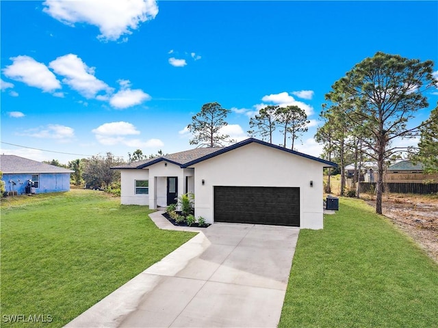 view of front of house with a front lawn, central AC unit, and a garage