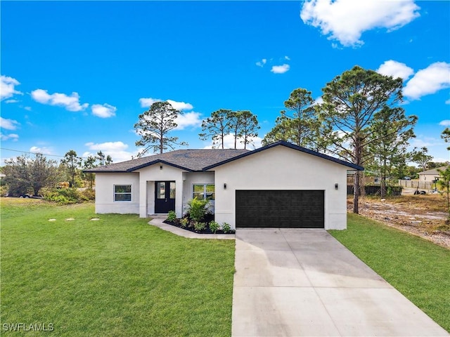 view of front facade featuring a front yard and a garage