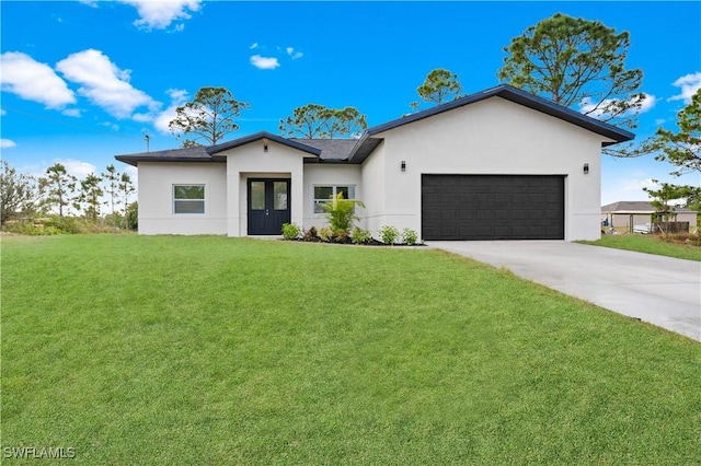 view of front facade featuring a garage and a front lawn