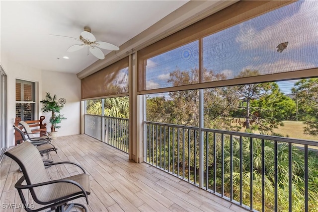 sunroom featuring ceiling fan