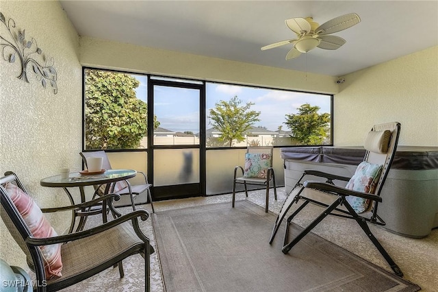 sunroom / solarium featuring ceiling fan