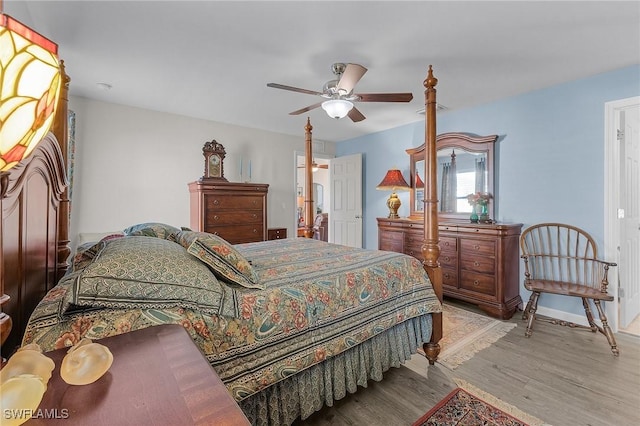 bedroom featuring light hardwood / wood-style flooring and ceiling fan